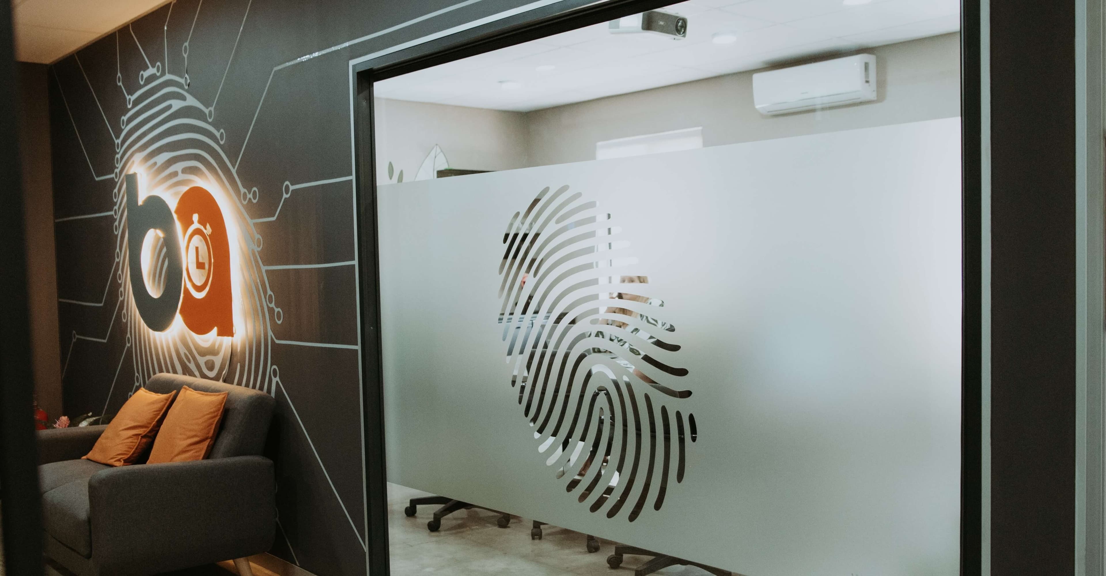 Modern office workers collaborating on biometric time and attendance solutions in South Africa