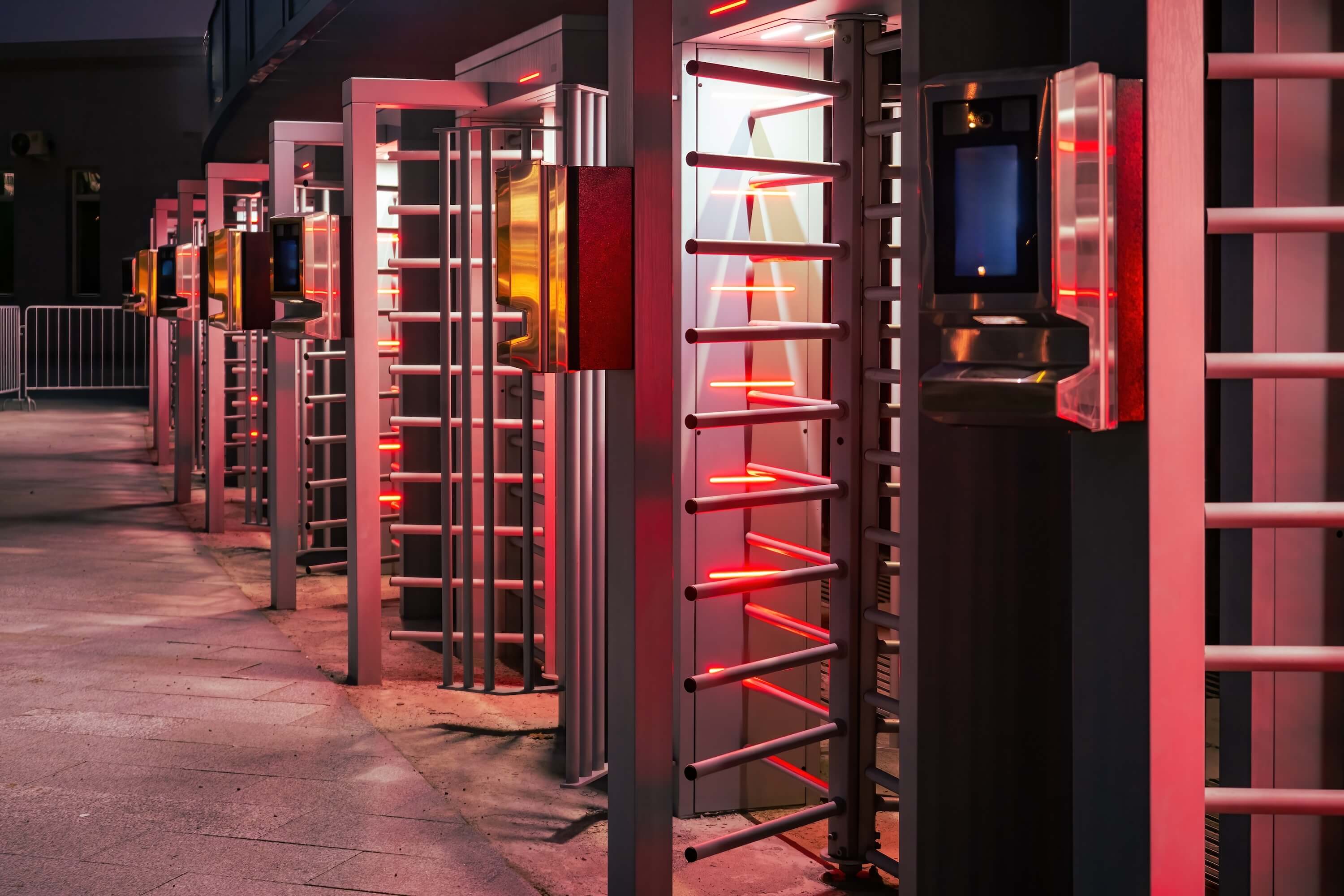 Security professional monitoring biometric access control system at South African business facility